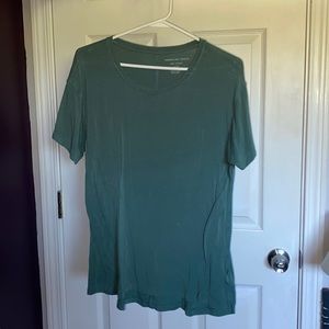 American eagle short sleeve top slightly used, small dot stain of Bleach